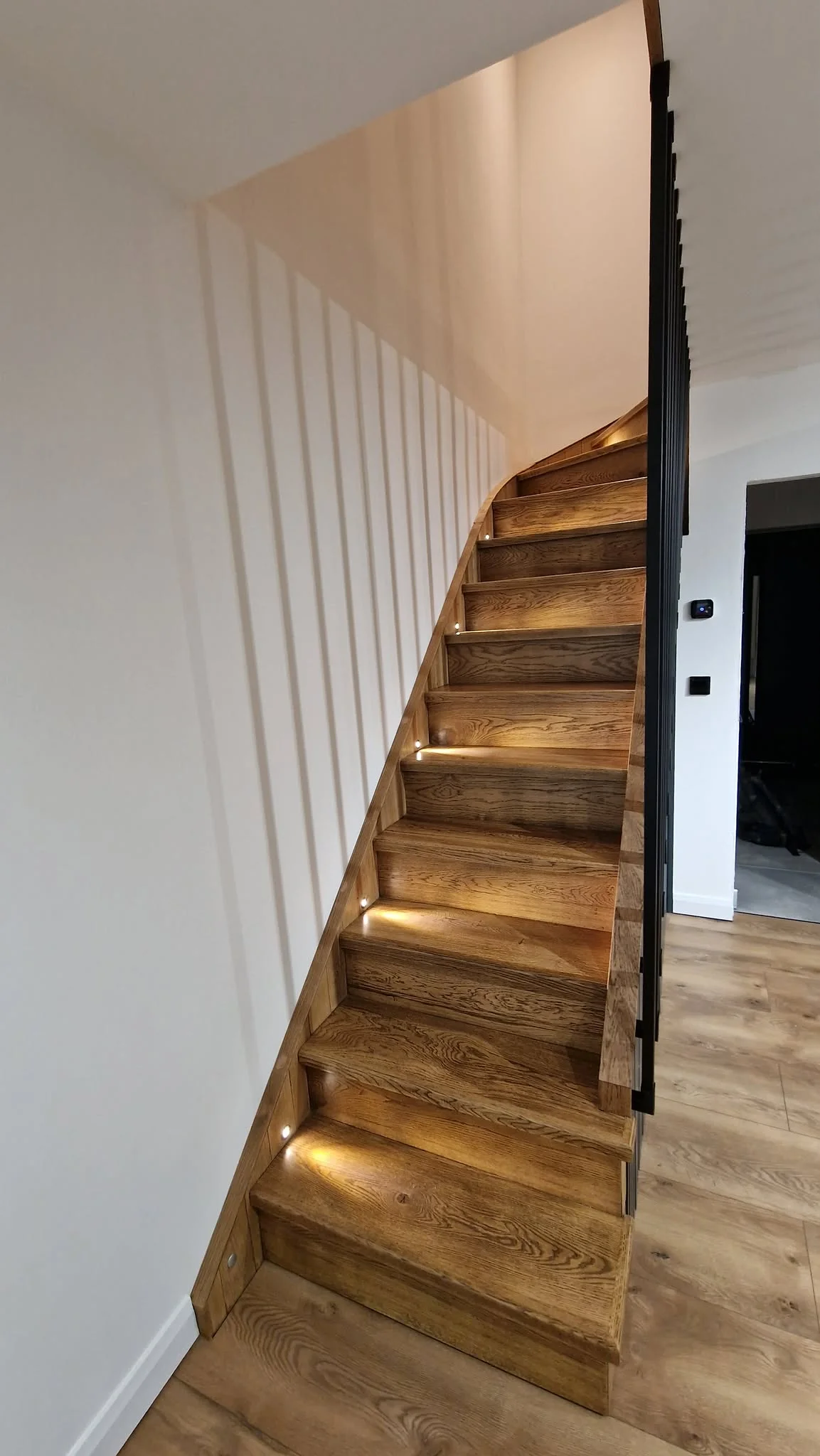 Custom oak staircase with integrated LED step lighting